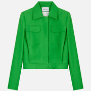 Blouson jacket with buttoned fly front in meadow-green wool satin. PALLAS PARIS